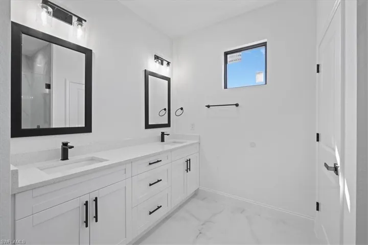 Full bath featuring double vanity, with separate Toilet room.