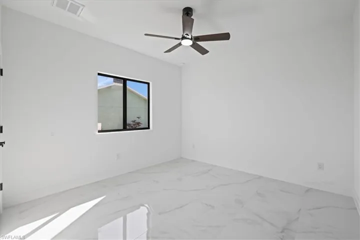 Unfurnished 2nd bedroom featuring ceramic finish flooring and ceiling fan