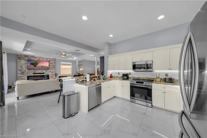 View of open exquisite kitchen area and living room