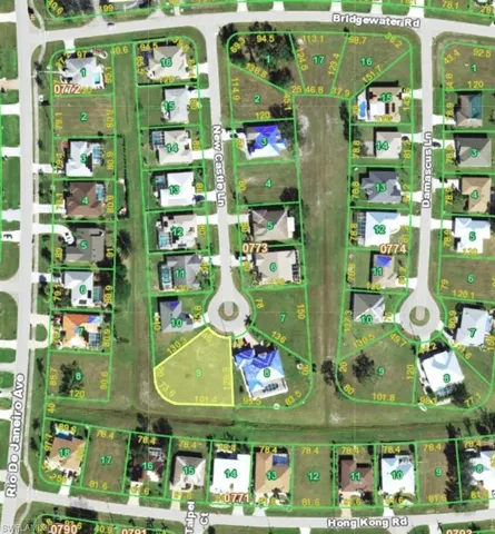 Aerial perspective of suburban area featuring property parcel outlined
