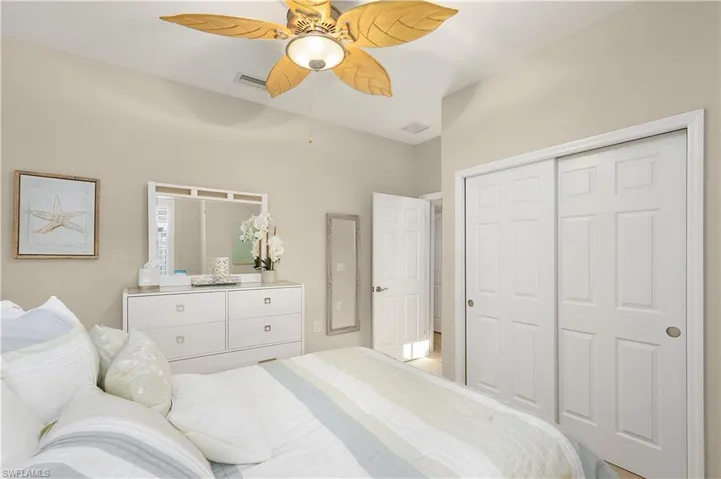 Bedroom with a closet and ceiling fan