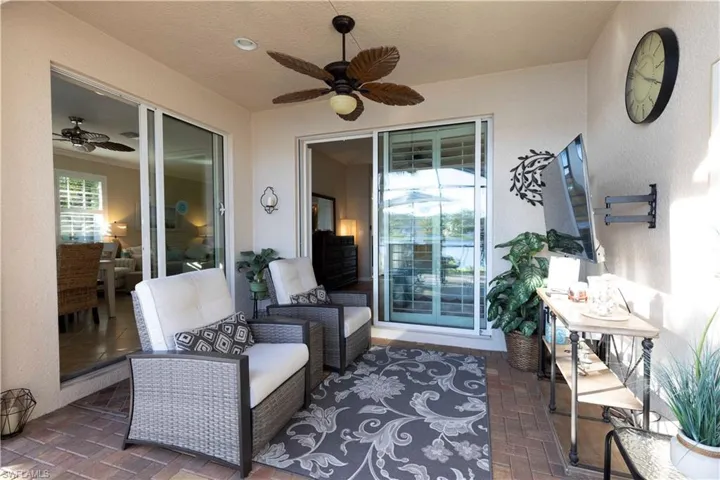 View of patio featuring an outdoor living space and ceiling fan