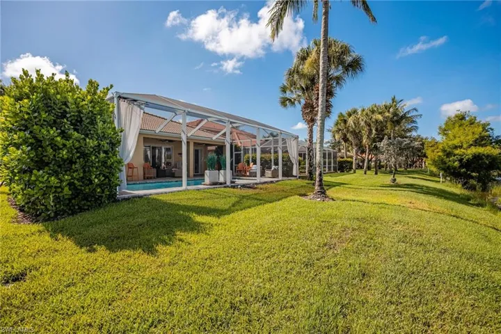 View of yard featuring a lanai