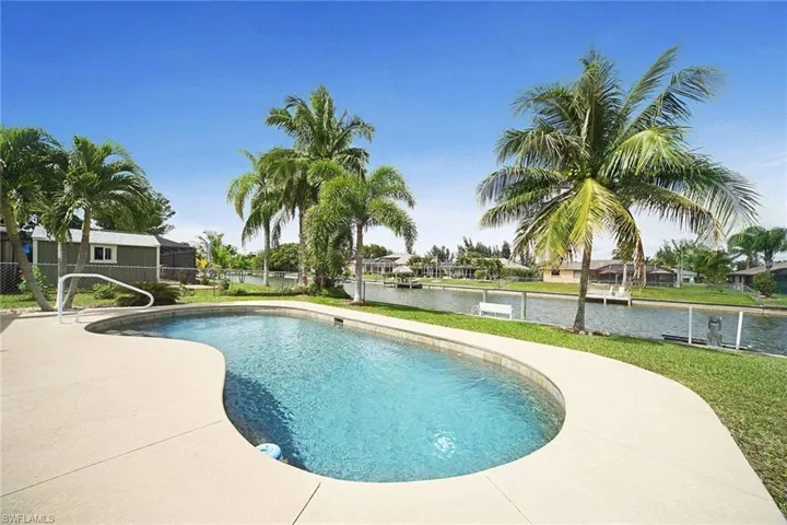 Swimming pool featuring a water view