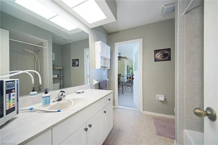 Guest bathroom w/ vanity and shower/tub combo