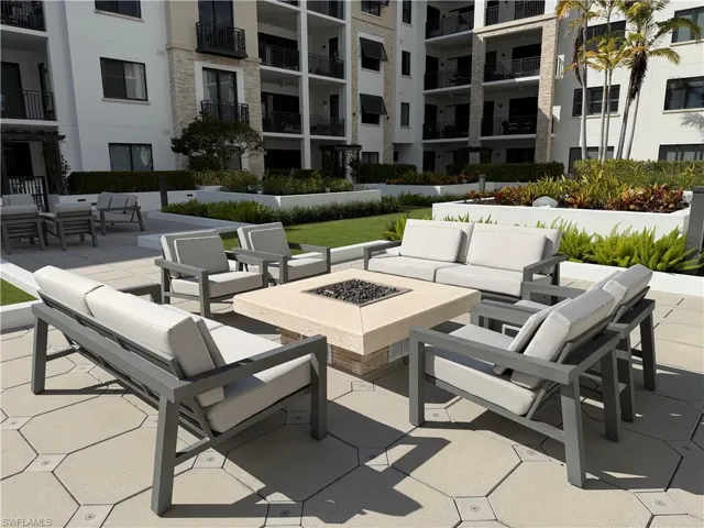 View of patio / terrace featuring an outdoor living space with a fire pit