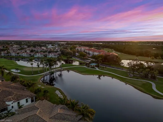 Aerial view at dusk with a water & golf course view