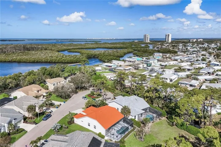 Aerial view of residential area with a nearby body of water