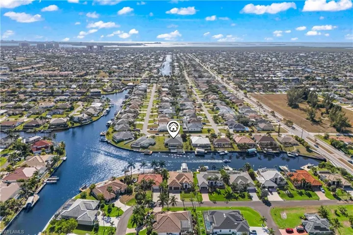 View of property location with nearby suburban area and a large body of water