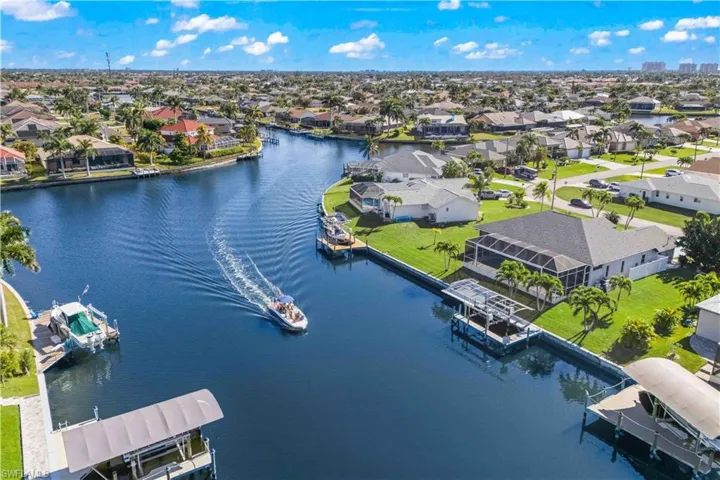 Aerial perspective of suburban area with a nearby body of water