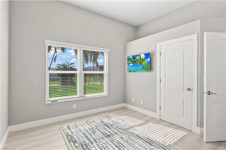 Unfurnished bedroom featuring baseboards and light wood-style flooring