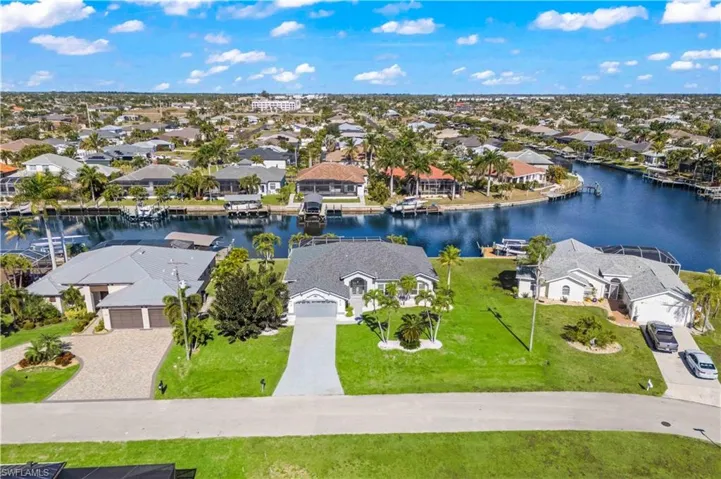 Aerial view of residential area with a nearby body of water