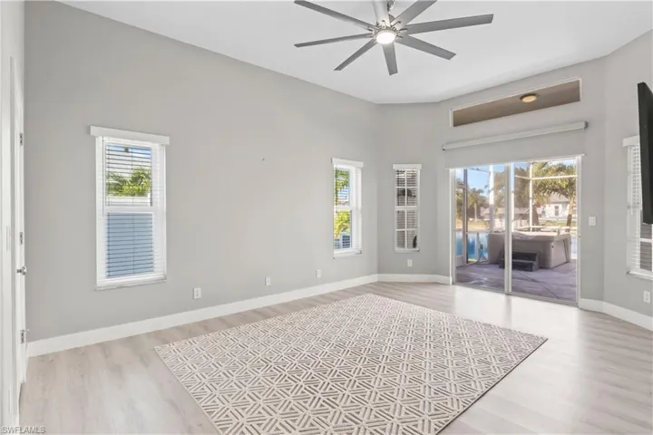 Unfurnished room with light wood-style flooring and ceiling fan