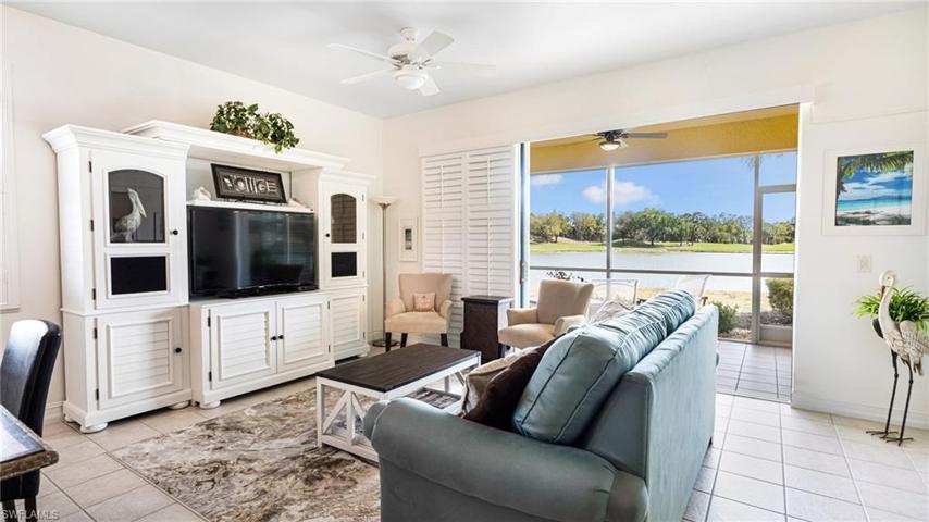 Great room with tile floors and plantation sliders
