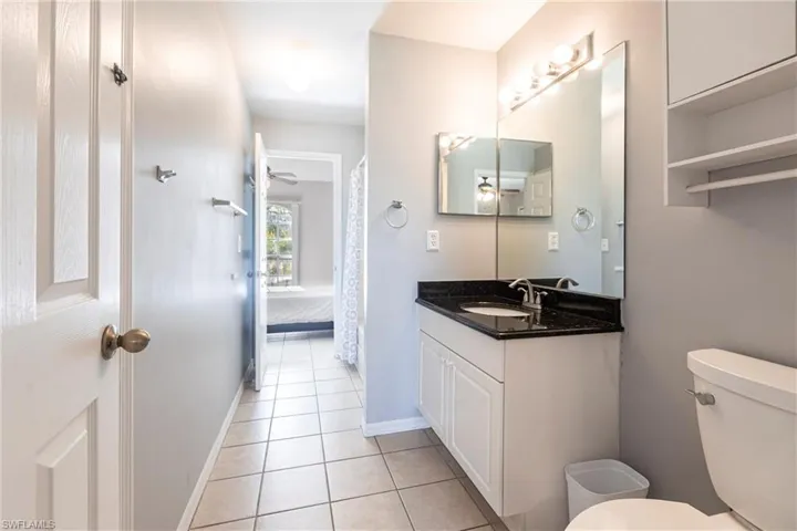 Full bath featuring tile patterned flooring and vanity