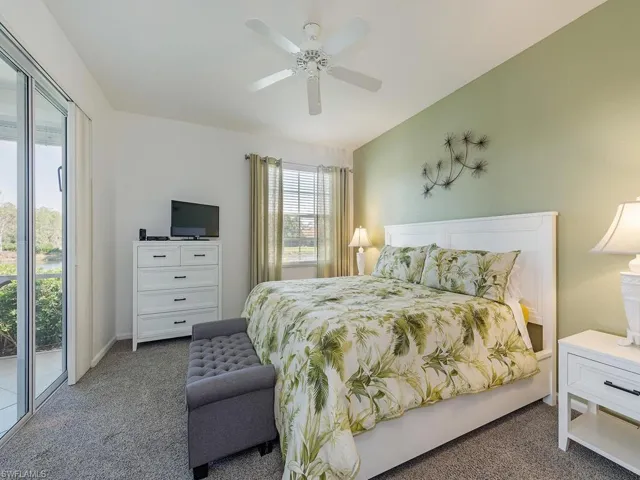 Spacious Primary bedroom with access to lanai and lake views