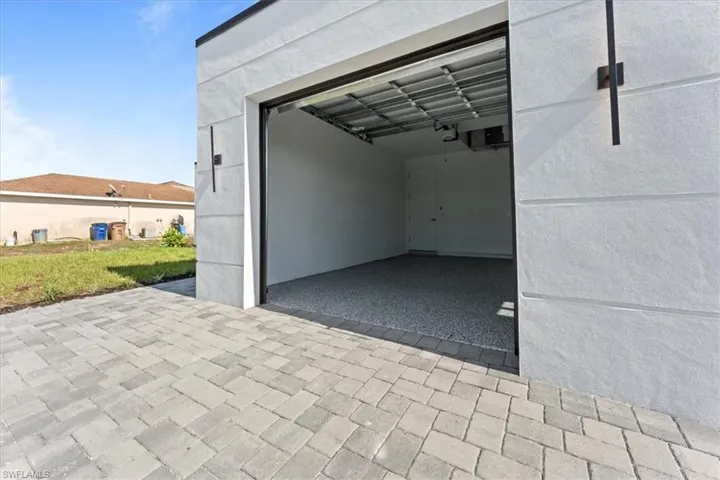 Garage featuring a garage door opener