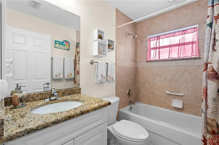 Guest bathroom with full shower & tub -Virtually enhanced