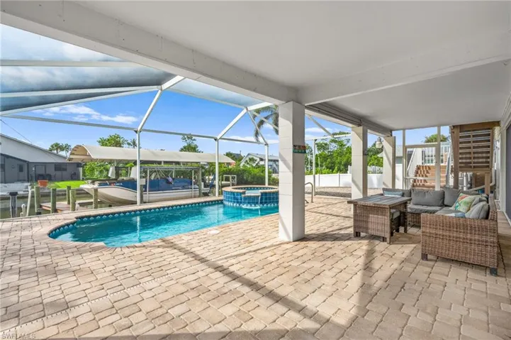 Pool & spa with large screened lanai and canal views -Virtually enhanced