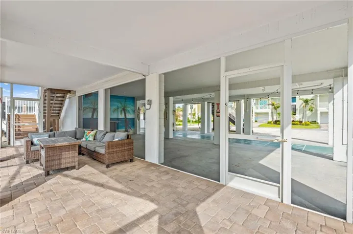 View of patio / terrace featuring stairs and an outdoor hangout area -Virtually enhanced
