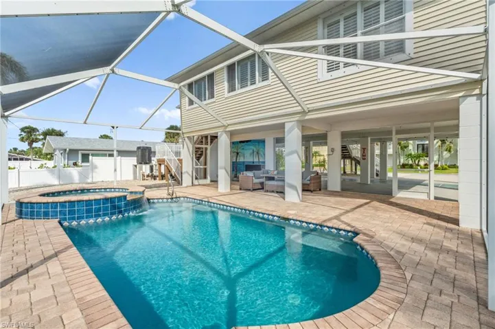 Sparkling swimming pool with screened in lanai-Virtually enhanced