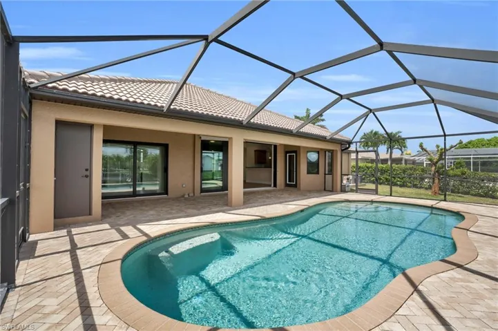 View of pool featuring a lanai and a patio area