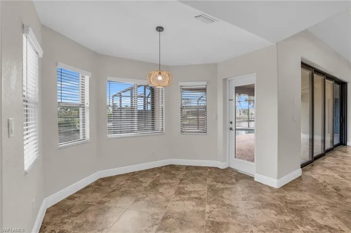 Unfurnished dining area featuring light tile floors