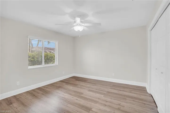Unfurnished bedroom with a closet, ceiling fan, and light hardwood / wood-style floors