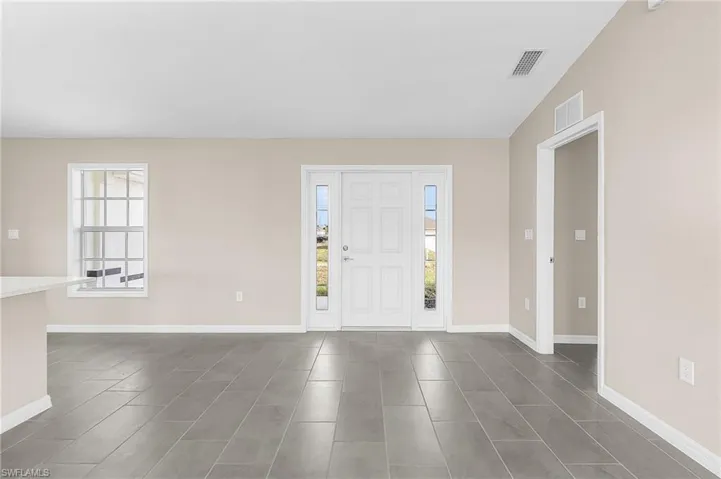 Entrance foyer featuring baseboards