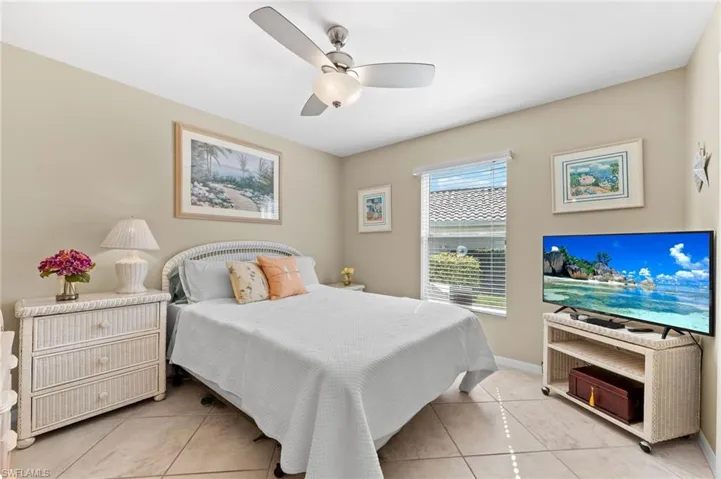Bedroom featuring a ceiling fan and light tile patterned floors