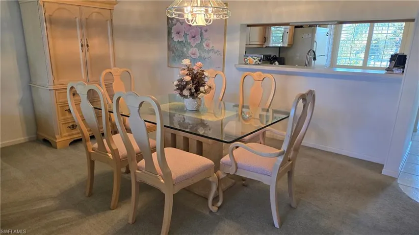 Dining area open to kitchen and breakfast bar for easy entertaining