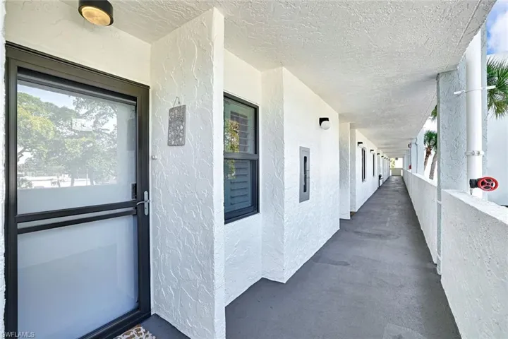View of exterior entry with stucco siding