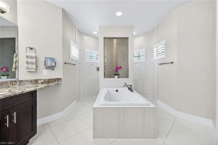 Primary bath with garden tub and walk-behind shower!