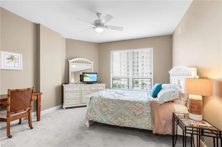 Bedroom with carpet flooring and ceiling fan
