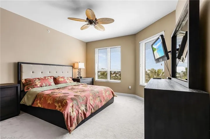 Bedroom with carpet flooring and ceiling fan