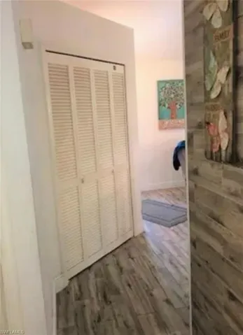 Hall with wood finished floors