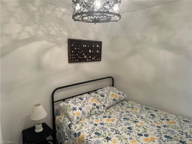 Queen size bed in den area.