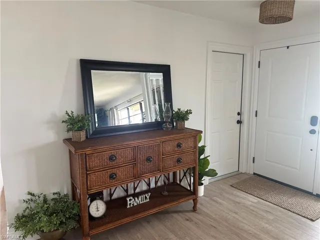 Entryway with light hardwood / wood-style flooring