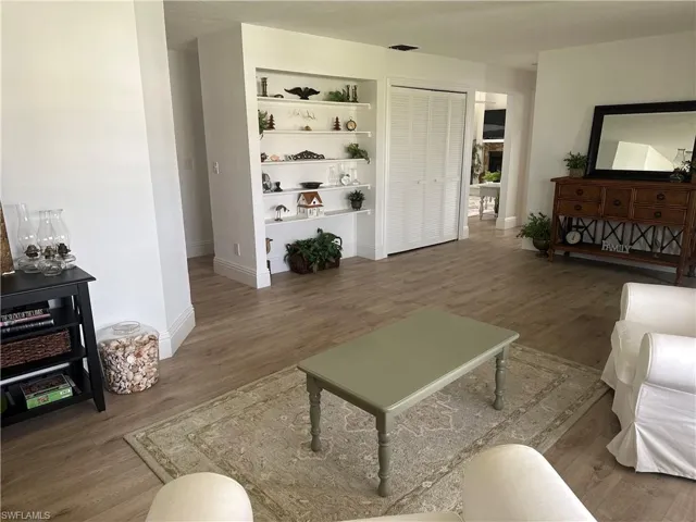 Living room with hardwood / wood-style floors