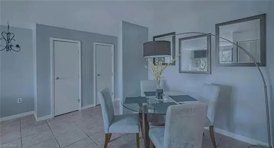Dining space with light tile floors