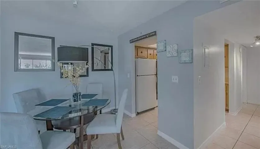 Dining room with light tile floors