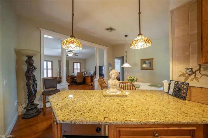 Kitchen looking into dining area and office