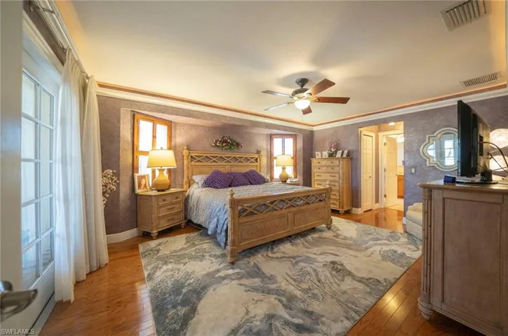 Primary bedroo with French doors to lanai