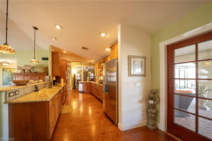 Kitchen with ample storage and granite counters, stainless appliances