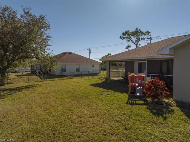 View of yard with a sunroom