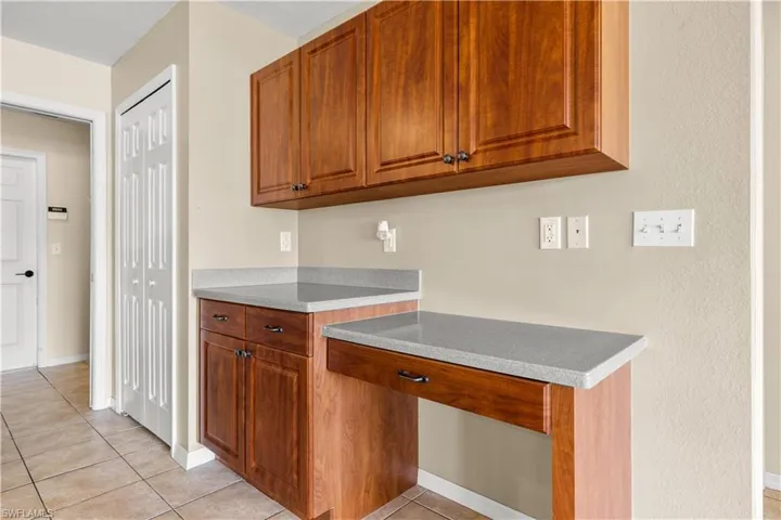Kitchen with light tile patterned floors