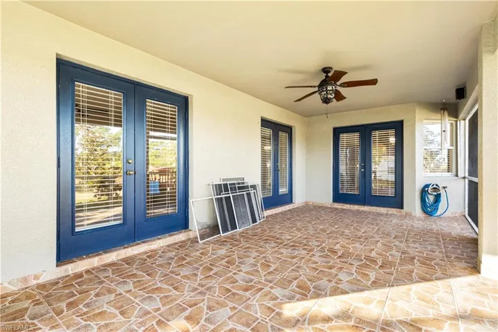View of patio / terrace with ceiling fan and french doors