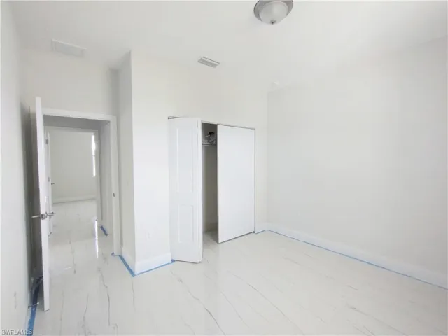 Unfurnished bedroom with a closet