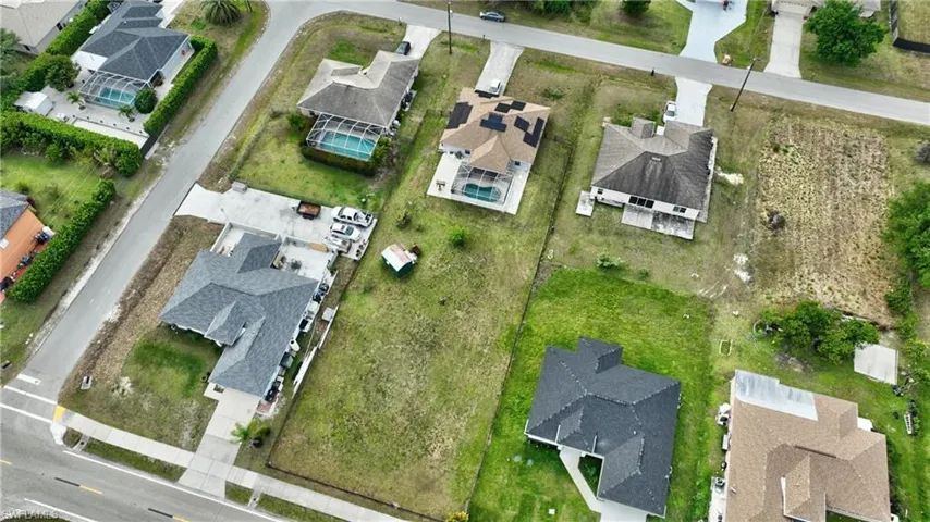 Birds eye view of property with a residential view
