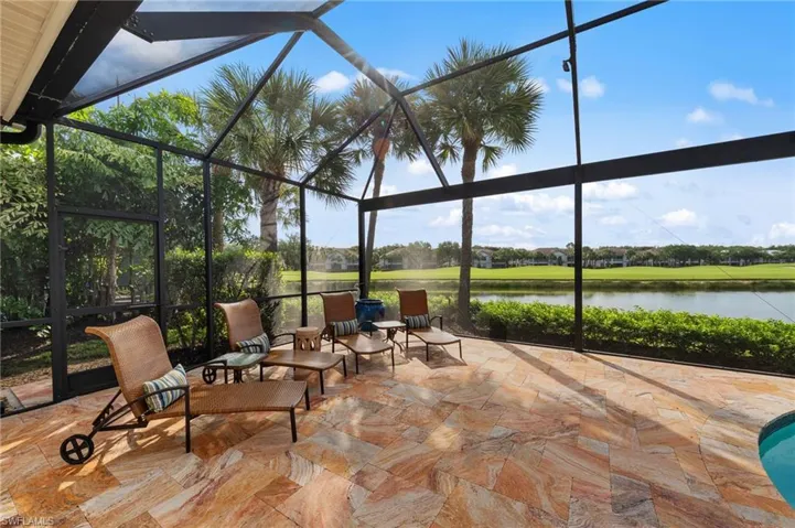 Screened lanai featuring large format natural stone tile flooring